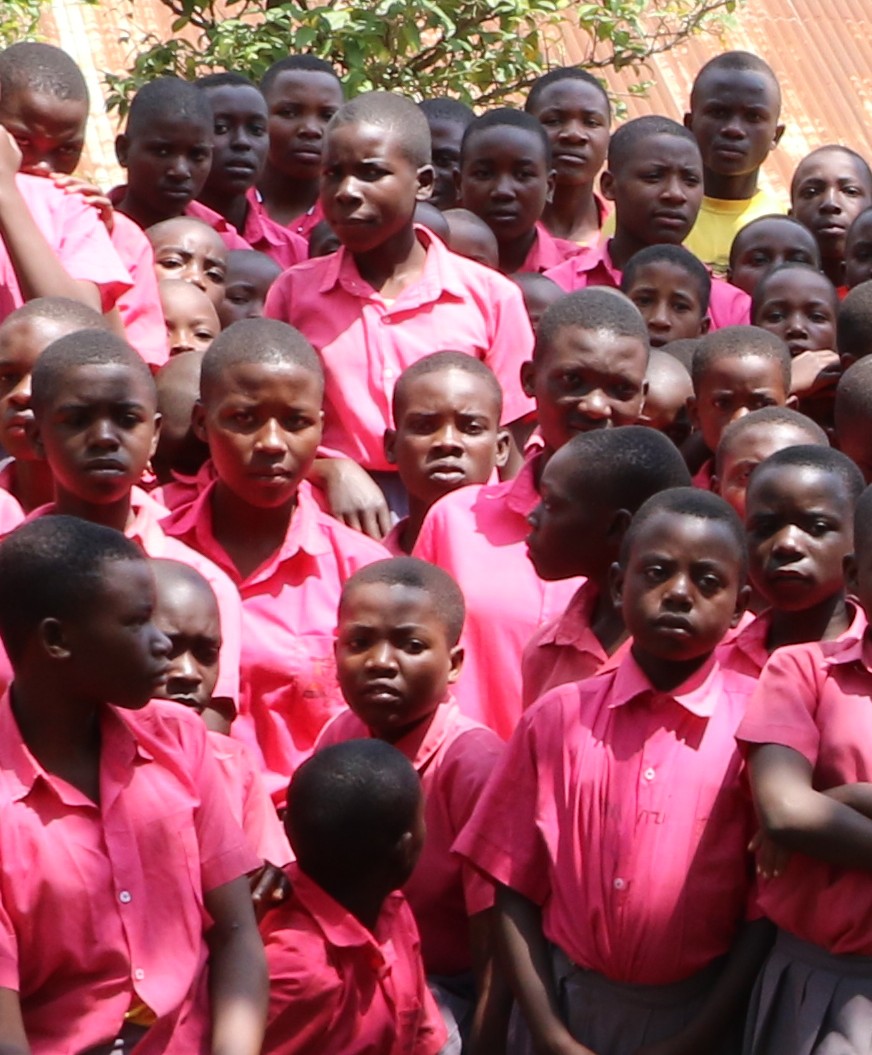 Students in pink uniforms gathered together at Rubona Primary School.